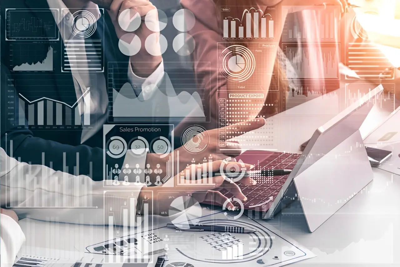 Business professionals work on laptops with data analytics graphics overlay, including charts, graphs, and infographics, suggesting a focus on analysis and strategic planning.