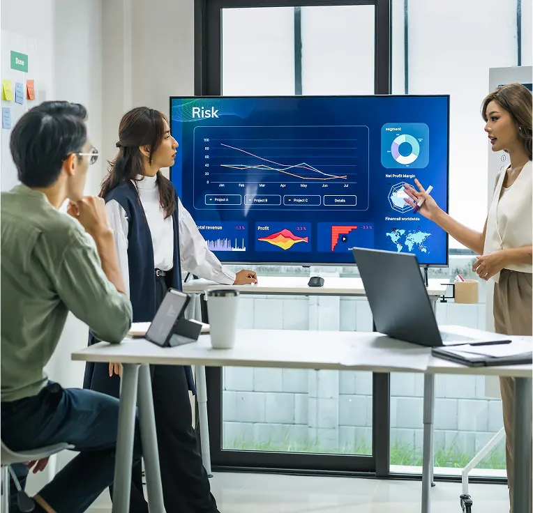 Team reviewing risk dashboard on screen